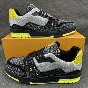 Louis Vuitton / Louis Vuitton  LV TRAINER Sneakers with Diamonds  This LV Trainer sneaker features glittering faux-crystal elements applied to the shoe’s surface, paired with matching laces and a rubber outsole, creating a striking visual effect. The original design was created by Virgil Abloh, showcasing the inspiration drawn from retro basketball shoes.